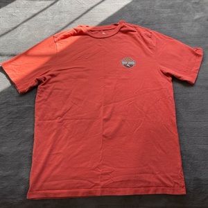 Salmon colored oversized t-shirt.